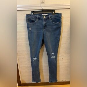 Levi's 311 Shaping Skinny Distressed Jeans.